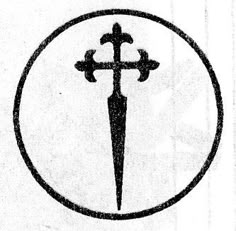 a black and white photo of a cross in a circle with two crosses on it