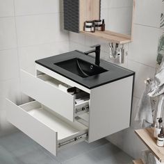 a bathroom vanity with drawers and a sink