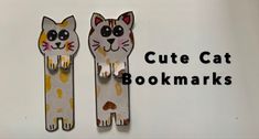 two paper cut out cats sitting next to each other with the words cute cat bookmarks on them