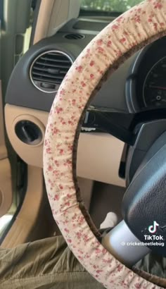 a steering wheel cover with flowers on it