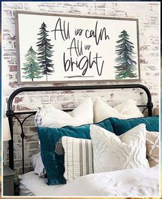 a bed with pillows and blankets in front of a sign that says, all you can do is bright