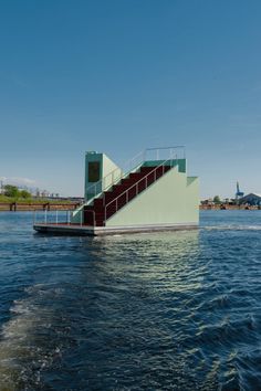 there is a boat with stairs going down the water