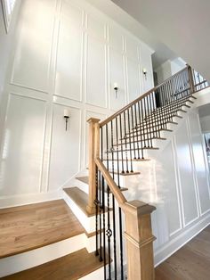 a staircase in a house with white walls