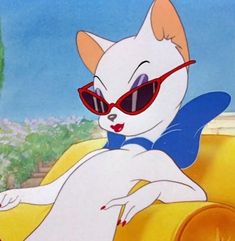 a cartoon cat wearing sunglasses sitting on top of a yellow couch