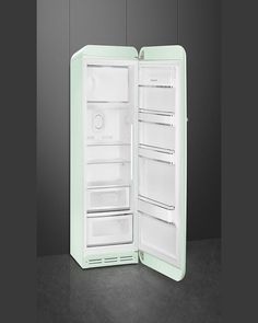 an open refrigerator with its door wide open on a dark floored surface, in front of a gray wall