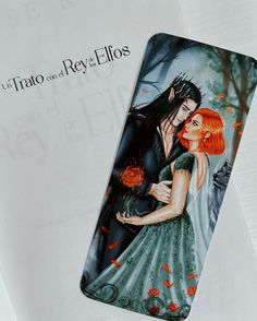 a bookmark with an image of a man and woman hugging in front of a tree