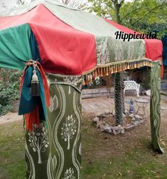 a large tent sitting on top of a lush green field