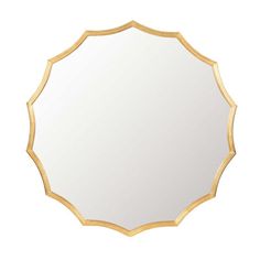 a gold framed mirror on a white background