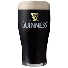 a glass filled with guinness beer sitting on top of a table