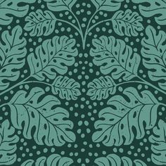 a green and blue pattern with leaves on it