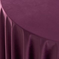 a close up view of a purple table cloth