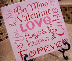 a pink sign that says be mine valentine's love hugs kisses and kisses forever