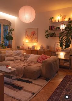 a living room filled with furniture and candles