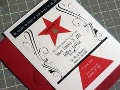 a red and white wedding card with a star on it