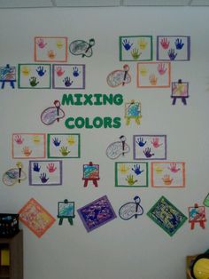 a white wall covered in lots of different colored handprints and writing that says mixing colors