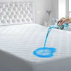 someone is pouring water into a bed