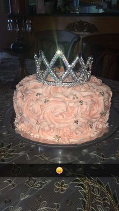 a cake with pink frosting and a tiara on top is shown in an instagram