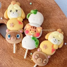 there are some cake pops with animals on them