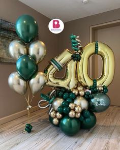 balloons and streamers are arranged in the shape of the number 50