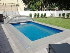 an above ground swimming pool in a backyard