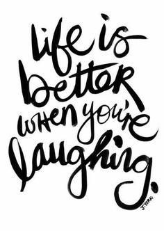 the words life is better when you're laughing are written in cursive writing