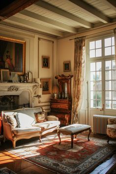 a living room filled with furniture and a fire place in front of a large window