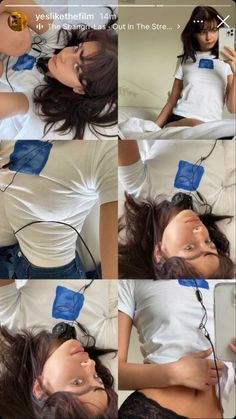 a woman laying on top of a bed wearing a white t - shirt with blue tape around her neck