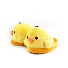 a pair of yellow slippers sitting on top of each other