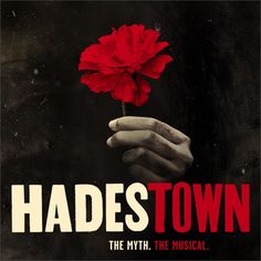 a hand holding a red flower with the words hades town on it