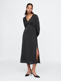 Soft satin midi dress.  Lace-trim V-neck.  Long sleeves.  Empire waist.  Slit at the hem.  Fit: Slim.  An A-line silhouette that sits close to the body with a flared opening.  Hits below the knee.  Models wearing Gap Amazon Black Dress, Midi Dress Black, Satin Midi Dress, Lace Midi Dress, Dress Lace, Black Midi Dress, Empire Waist, Lace Trim, Lace Dress