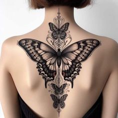 a woman with a butterfly tattoo on her back