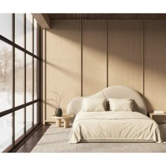 a large bed sitting in the middle of a bedroom next to a tall glass window