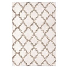 a white rug with an intricate design on the front and back side, in neutral tones