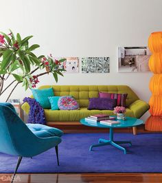 a living room filled with colorful furniture and decor