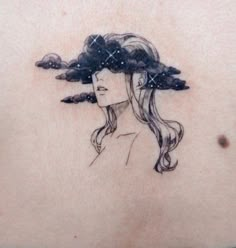 a woman with long hair and clouds on her back