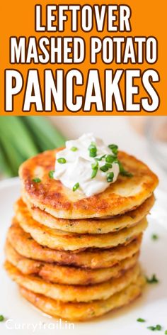 a stack of potato pancakes on a plate with sour cream and chives in the background