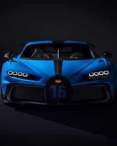 a blue bugatti car with the number 16 on it's front end