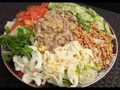 a large plate filled with lots of different types of food on top of a table