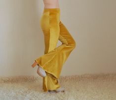 "Mustard velvet bell bottoms women I created this awesome mustard velvet bell bottoms from stretchy velvet.This cozy and so soft velvet flare pant will carry to you to 70s. This cute stretchy women leggings are so comfortable and stylish.You can wear this stylish and trendy leggings to go to festival,school,club, yoga or special occasion. SIZE INCHES; Extra Small (US 0-2) (AU 6 ) (UK 6) Waist: 26\" In seam:31\" Out seam:46\" Leg opening:29\" Small (US 2-4) (AU 8) (UK 8) waist: 28\" In Seam: 32\" Fitted Flares For Spring Festival, Retro Fitted Flares With Flared Hem, High Waist Fitted Velvet Bottoms, Fitted High Waist Velvet Bottoms, Fitted Velvet Flare Bottoms, Fitted Full-length Flares For Festivals, Fitted Velvet Pants For Winter, Fitted Full Length Flares For Festival, Fitted Velvet Winter Pants