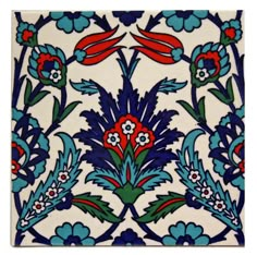 an artistic tile design with flowers and leaves on the bottom, in blue and red colors