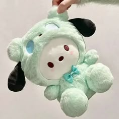 a stuffed animal hanging from the ceiling