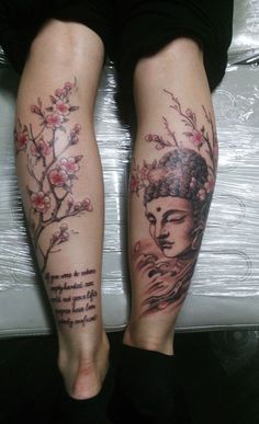 a woman's legs with tattoos and flowers on them