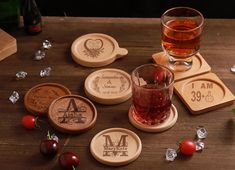 wooden coasters with personalized names and designs on them, along with cherries