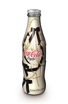 a coca cola bottle with chains around it