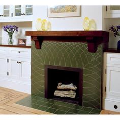 a living room filled with furniture and a fire place in the middle of a kitchen