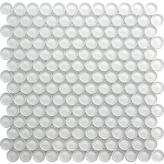 white glass mosaic tile with circles in the center and dots on the back ground,