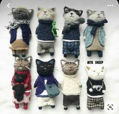 several knitted cats are lined up in different colors and sizes, with the caption miki sheep