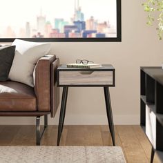 a living room scene with focus on the coffee table and chair in the foreground