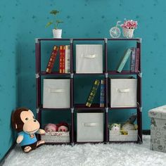 a toy is sitting on the floor in front of a bookcase