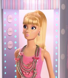 a barbie doll wearing a pink dress and necklace